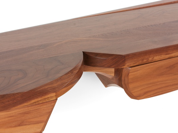 sculptural walnut console with four drawers
