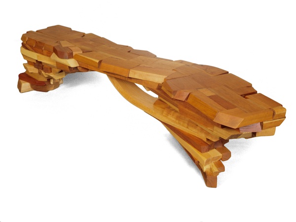 Sculptural bench made of many small pieces.