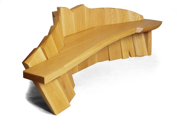 A cascading wave of white oak makes up the structre of the bench with a white oak seat nestled in