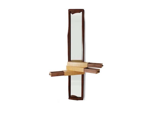 three drawers open on this sculptural mirror