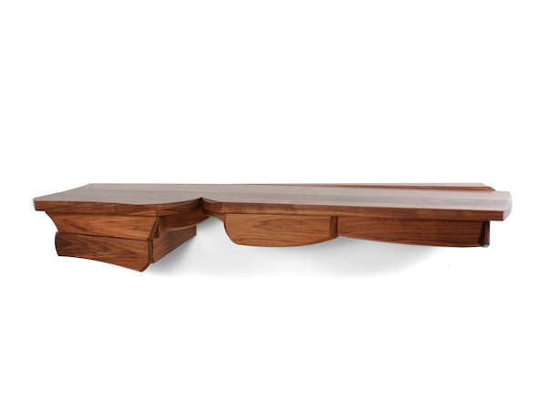 sculptural walnut console with four drawers