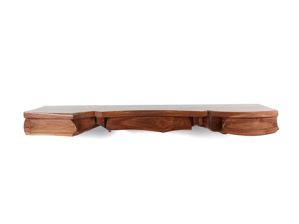 Sculptural wall hung console in walnut with assymetrical composition