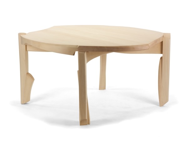 Dining Table #4- Modern Circular Dining Table is a five foot table that undulates from its circular beginings.  The movements relate to the legs that are pulled to the edge and pull up above the surface