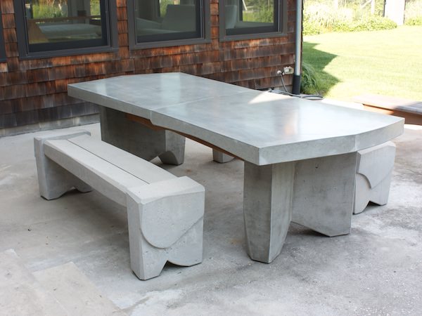 massive concrete dining table with bench